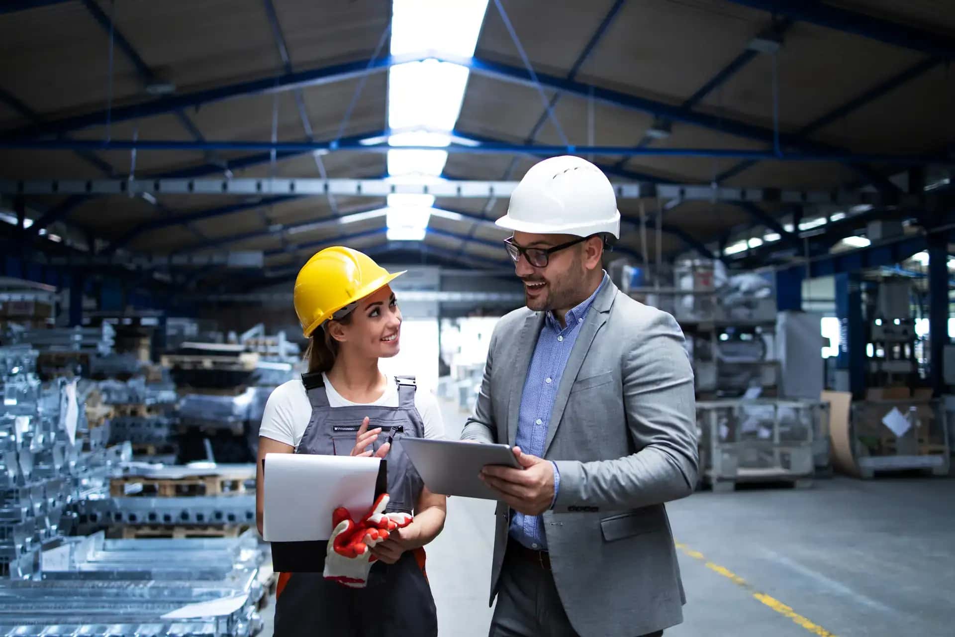 Engineers discussing production results on the factory floor