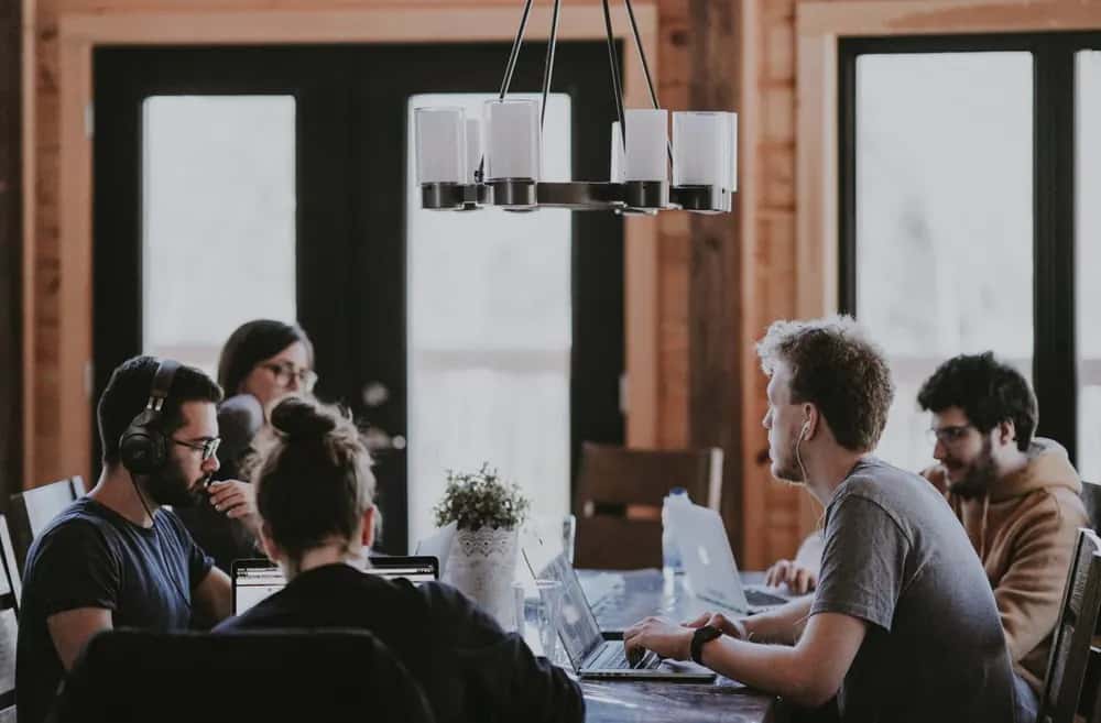 Team collaborating around a table in a bright workspace