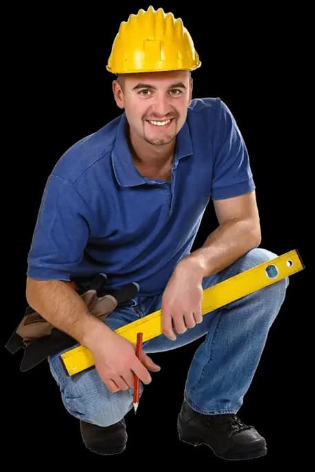Construction worker crouching with a spirit level