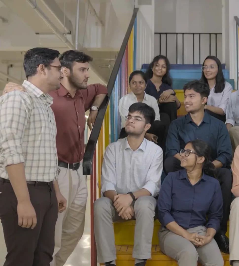Forbes Marshall interns together on the stairs