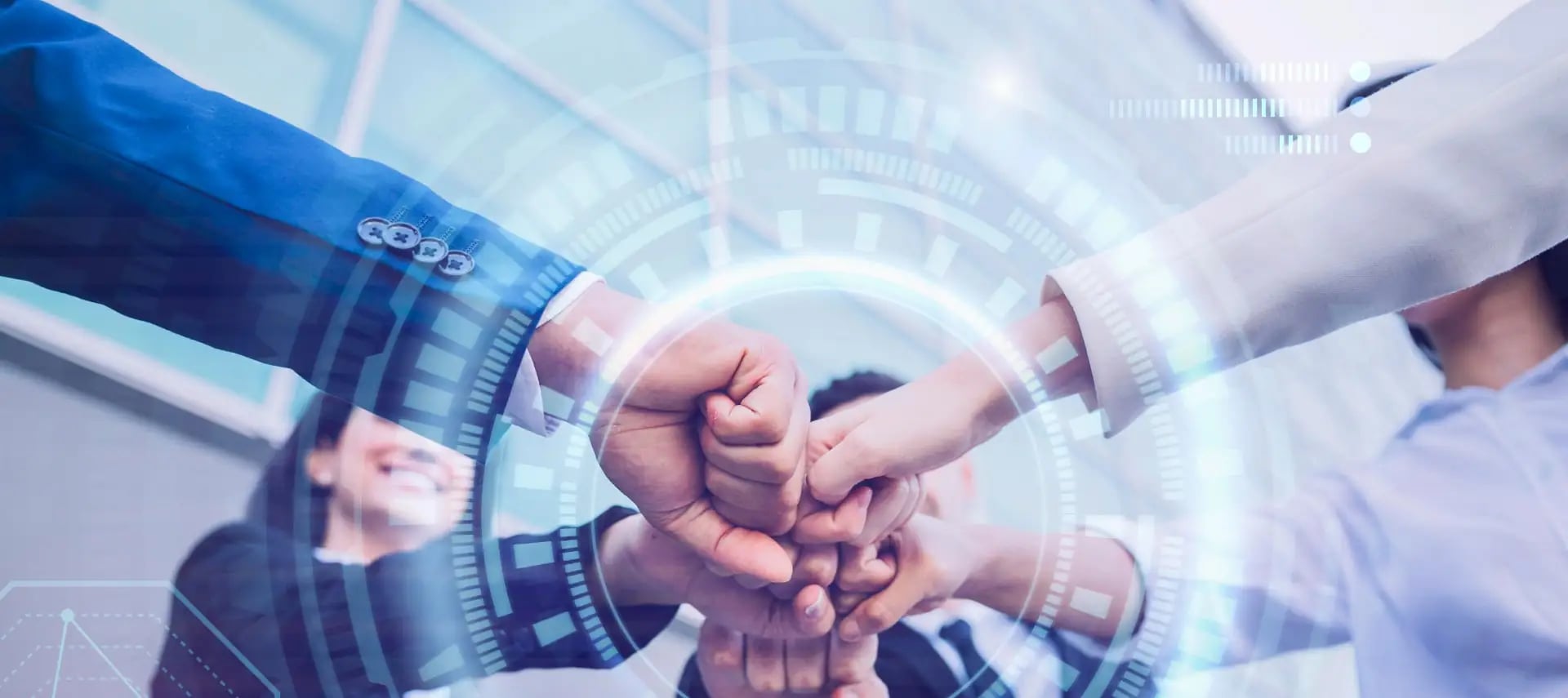 Team members bringing their hands together in collaboration