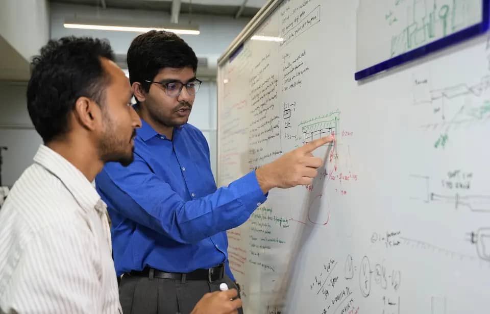 Engineers reviewing technical drawings in a meeting room